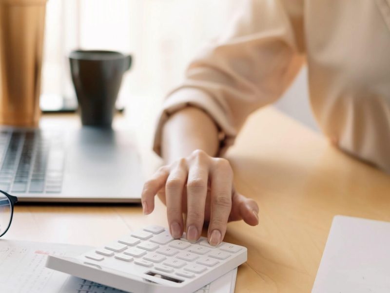 close-up-view-of-bookkeeper-or-financial-inspector-hands-making-report-calculating-or-checking.jpg